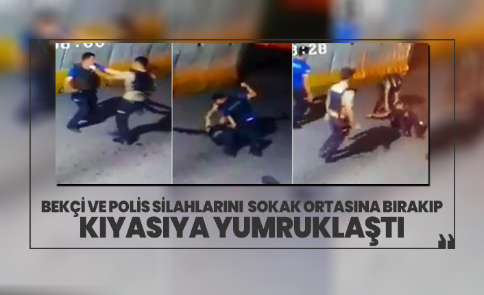 Bekçi ve polis silahlarını sokak ortasına bırakıp kıyasıya yumruklaştı