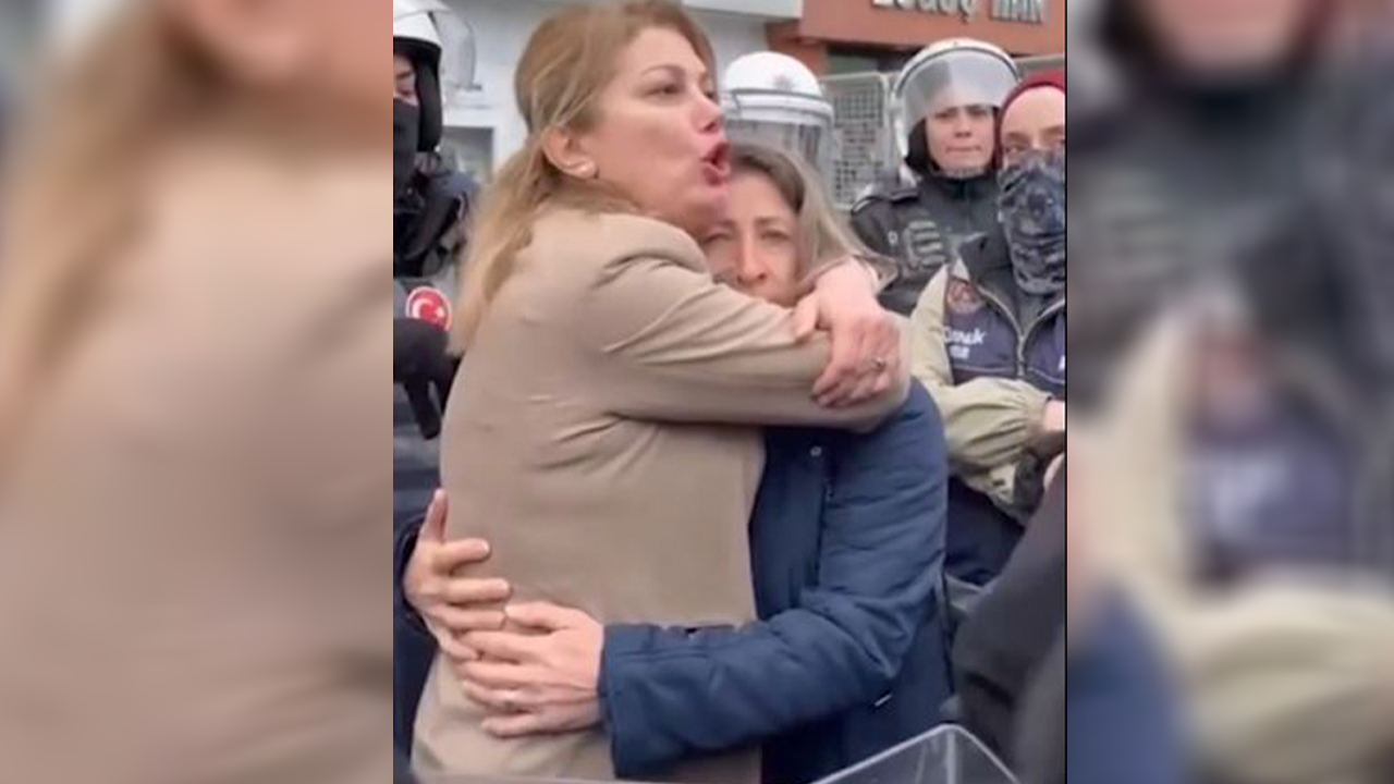 Kadın muhtar gözaltına alınmasın diye sımsıkı sarıldı